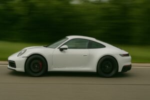 Driving a Porsche 911 Carrera GTS on a road in Germany