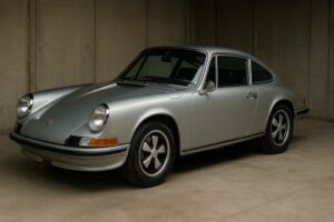 Classic silver Porsche 911 parked inside garage ready to import